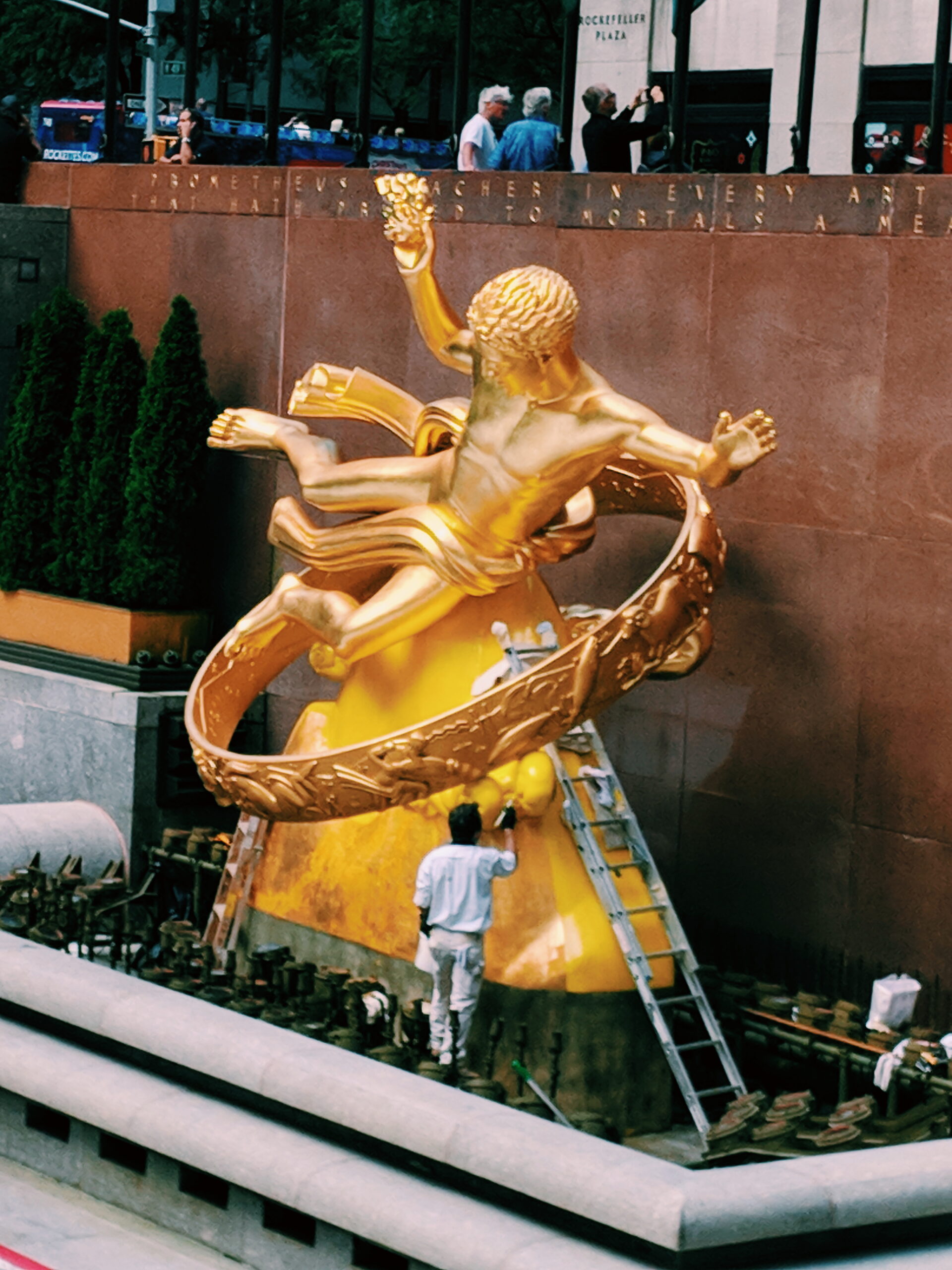 golden sculpture of a flying man