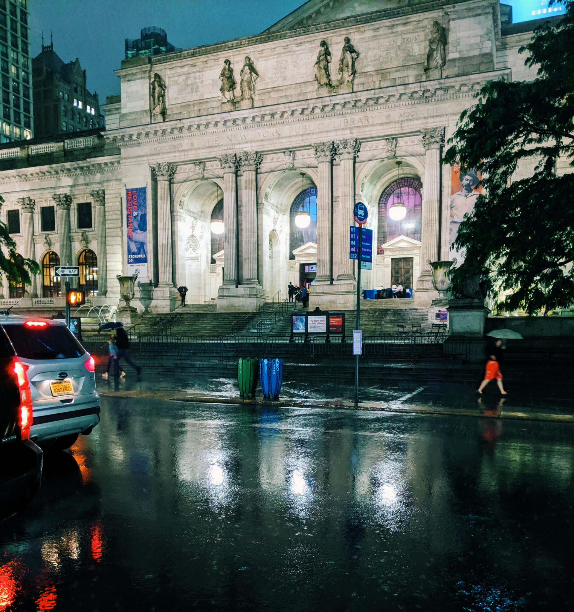 building of the main branch of the public library on fifth avenue in the rain