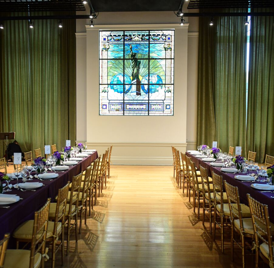 banquet room with a large window depicting Statue of Liberty