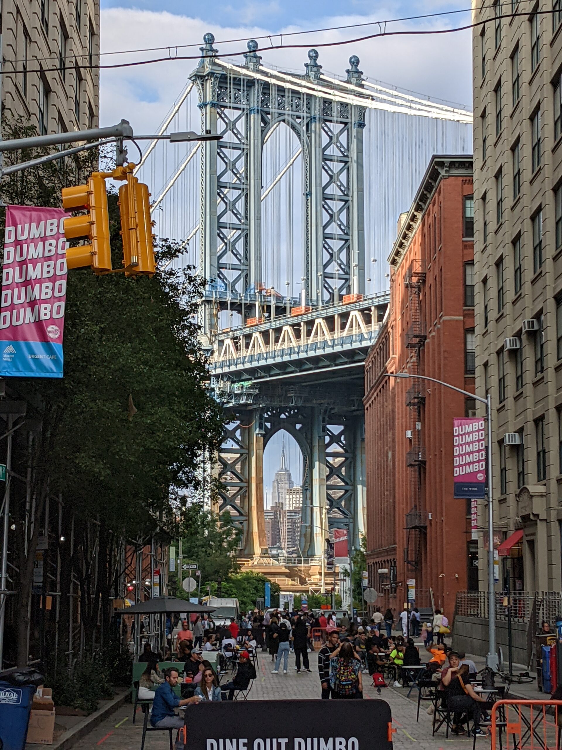 Manhattan Bridge pilon seen between buildings in DUMBO neighborhood of Brooklyn