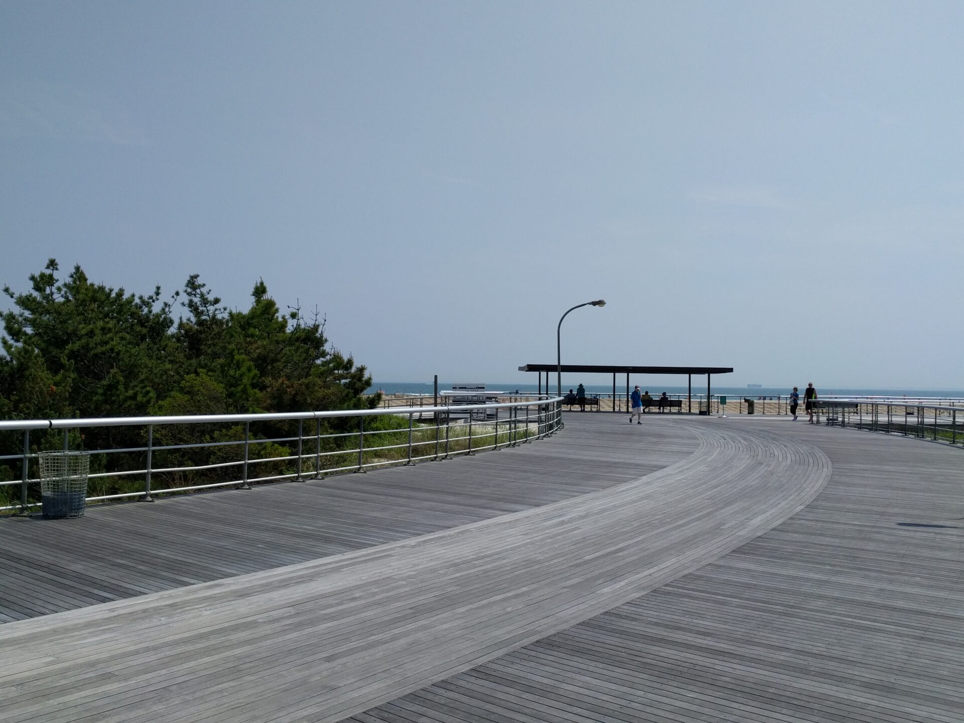 a wide boardwalk near a beach