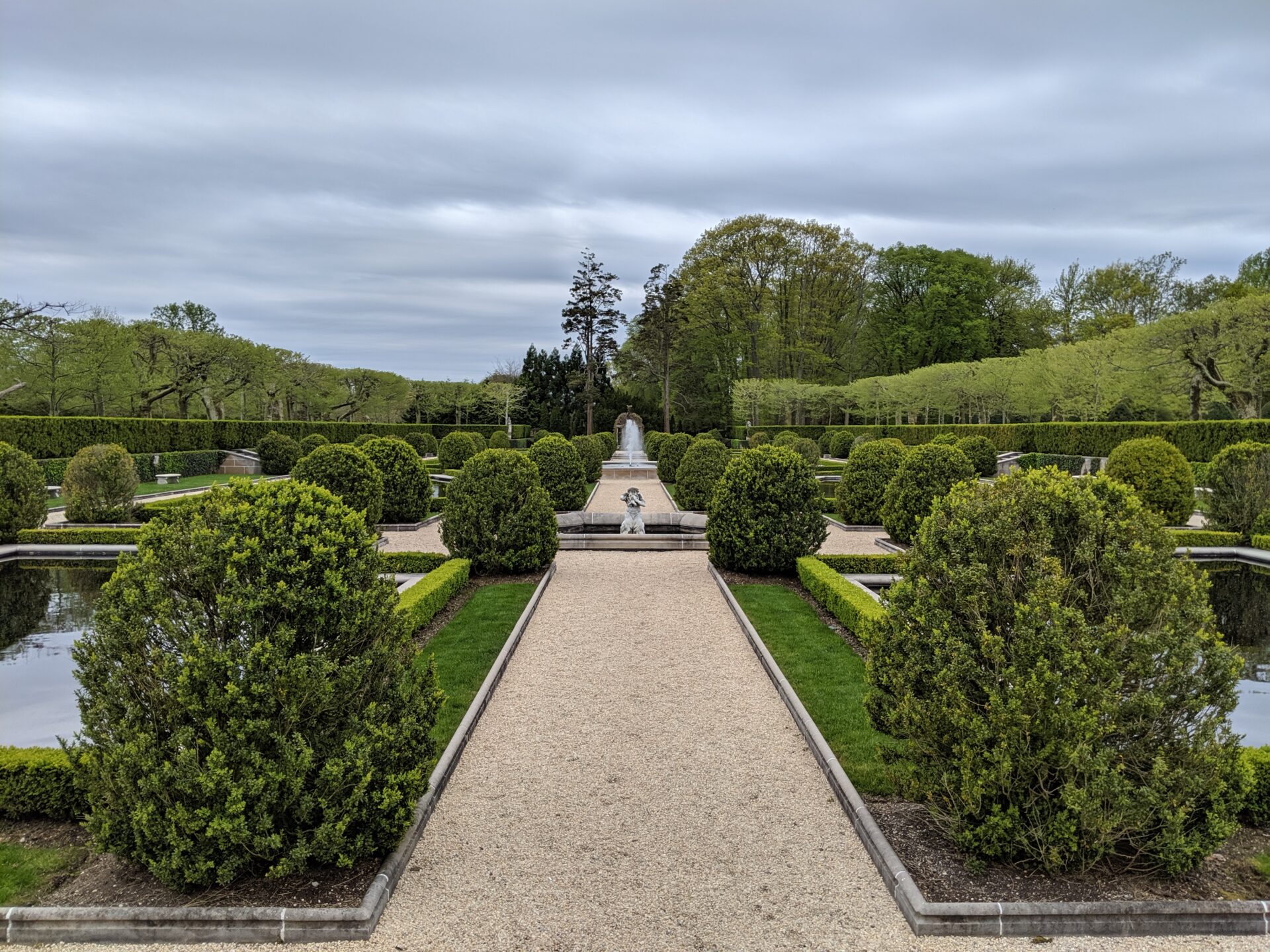 a formal garden with fountains